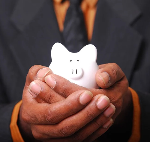 Man holding piggy bank